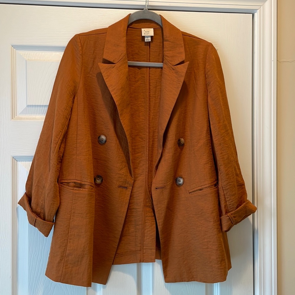 Rust colored blazer. Size small.
